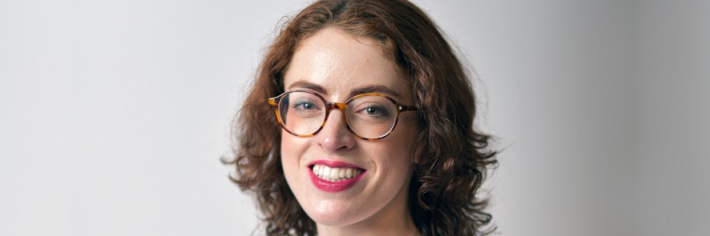 A headshot of Emma smiling against a white background.