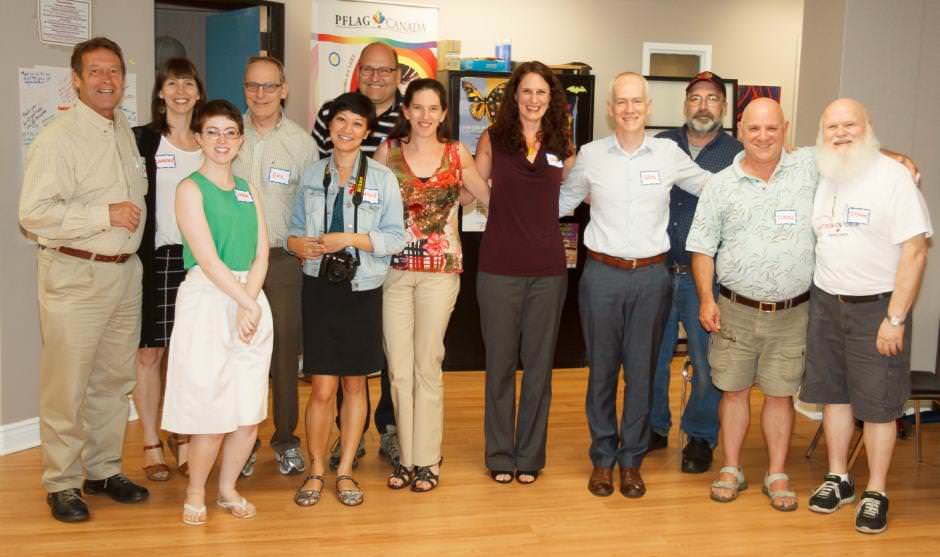 Raymond standing at a community centre with multiple members of the CREST.BD network, including Dr. Erin Michalak, Dr. Greg Murray, Dr. Emma Morton, Nusha Balram-Elliot, and Victoria Maxwell.